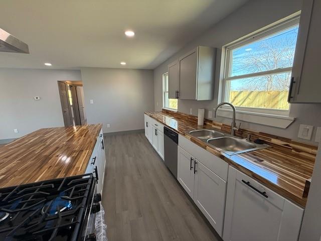 5845 Haney Drive Watauga, TX 76148 - Photo 15 of 37 a kitchen with stainless steel appliances granite countertop a stove a sink and a microwave