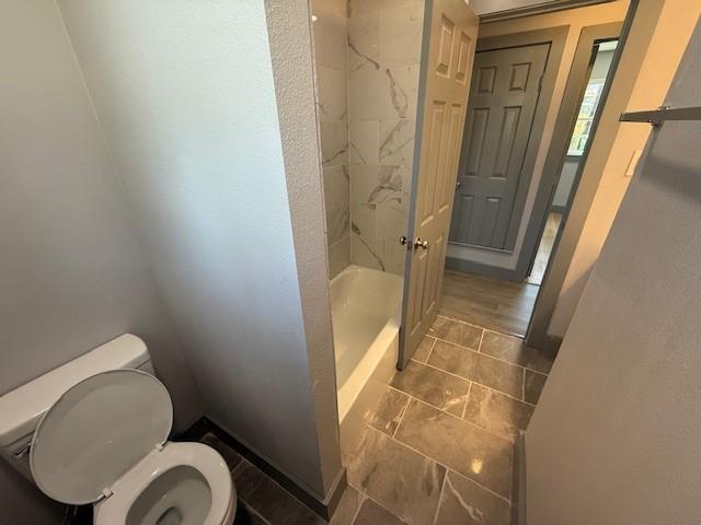 5845 Haney Drive Watauga, TX 76148 - Photo 18 of 37 a bathroom with a toilet and a shower