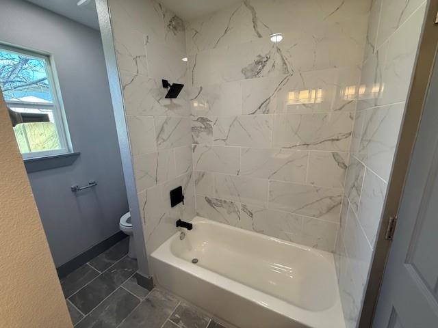 5845 Haney Drive Watauga, TX 76148 - Photo 19 of 37 a bathroom with a bathtub a toilet and a shower