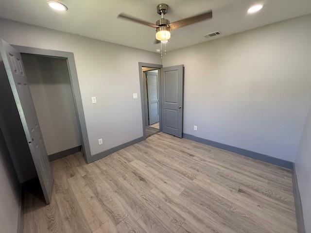 5845 Haney Drive Watauga, TX 76148 - Photo 22 of 37 an empty room with wooden floor and a ceiling fan