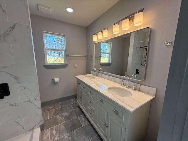 5845 Haney Drive Watauga, TX 76148 - Photo 27 of 37 a bathroom with a double vanity sink and a mirror