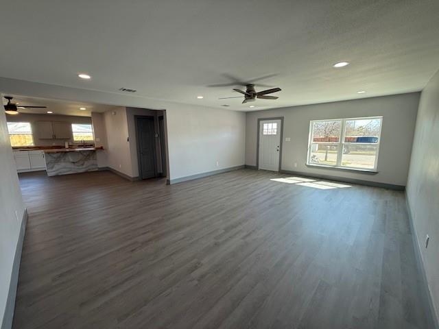 5845 Haney Drive Watauga, TX 76148 - Photo 7 of 37 a view of an empty room with a window and wooden floor