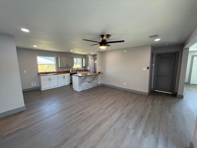 5845 Haney Drive Watauga, TX 76148 - Photo 36 of 37 an empty room with wooden floor a ceiling fan and windows