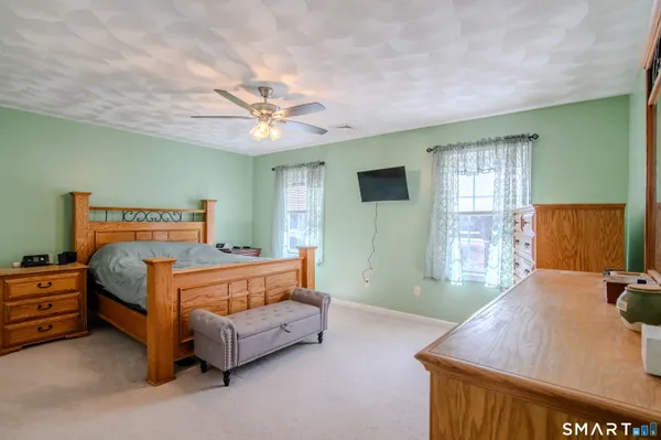 a bed room with a bed and a window