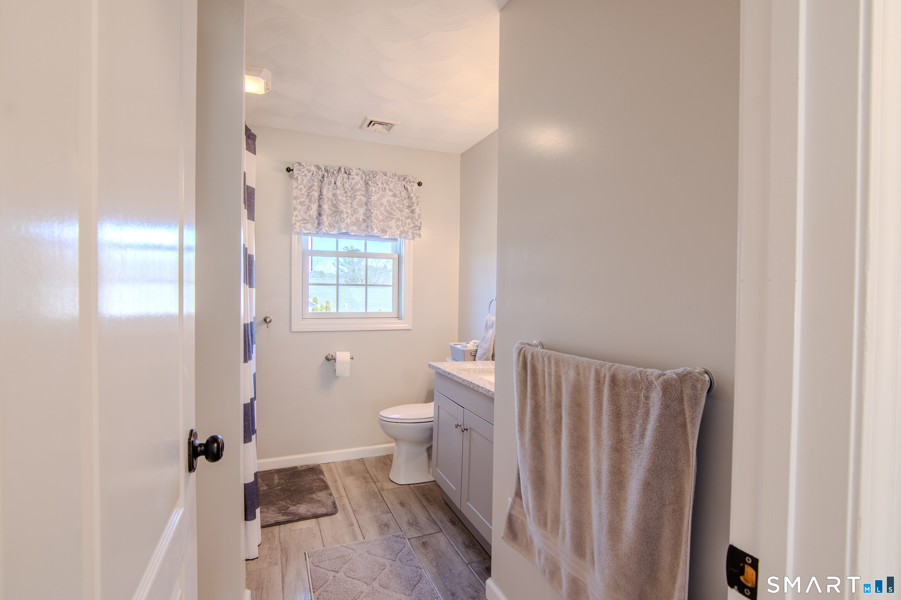 297 Sabin Street, Unit 1 Putnam, CT 06260 - Photo 18 of 20 a bathroom with a sink toilet and shower