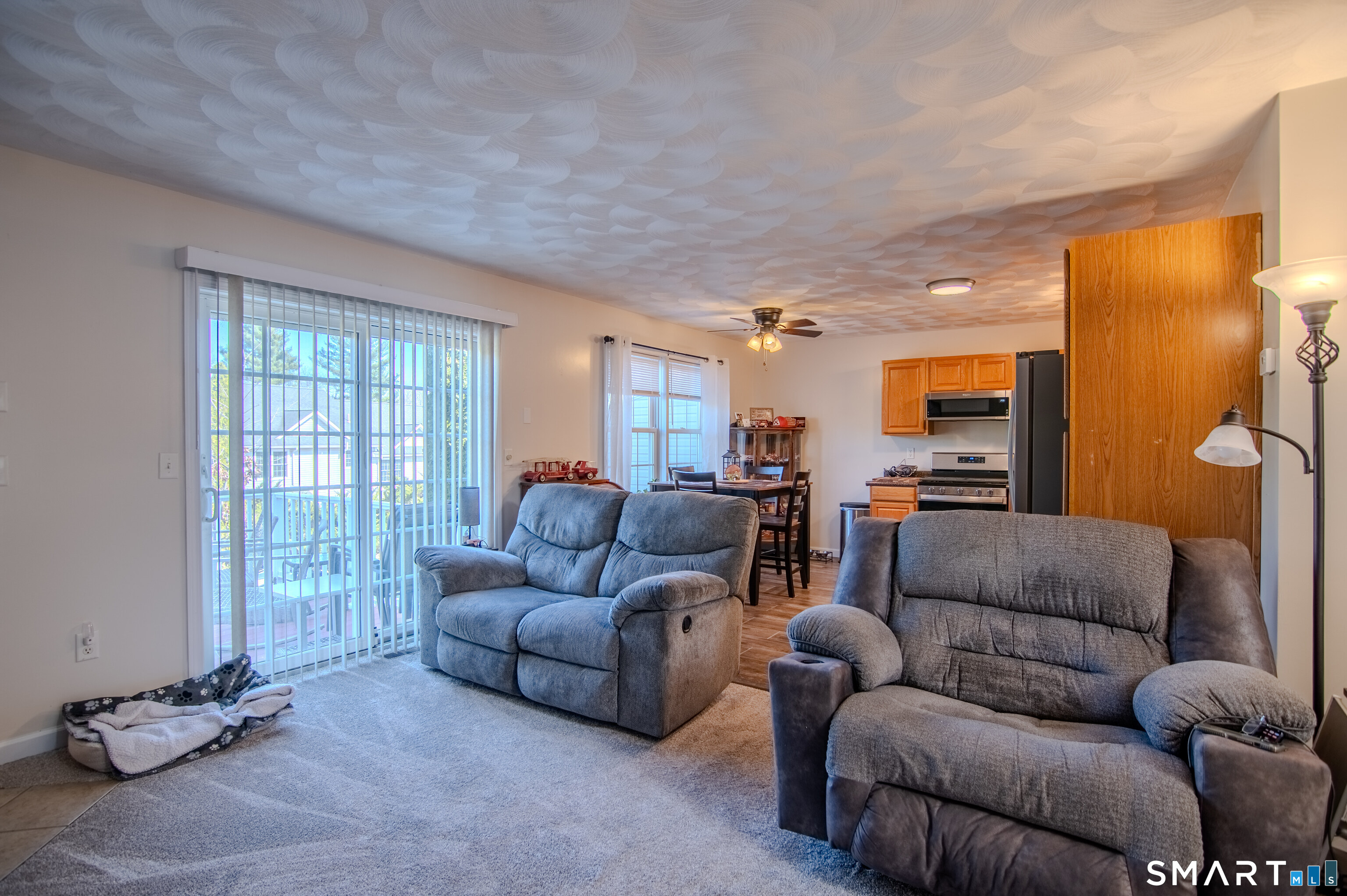 297 Sabin Street, Unit 1 Putnam, CT 06260 - Photo 4 of 20 a living room with furniture a couch and a window