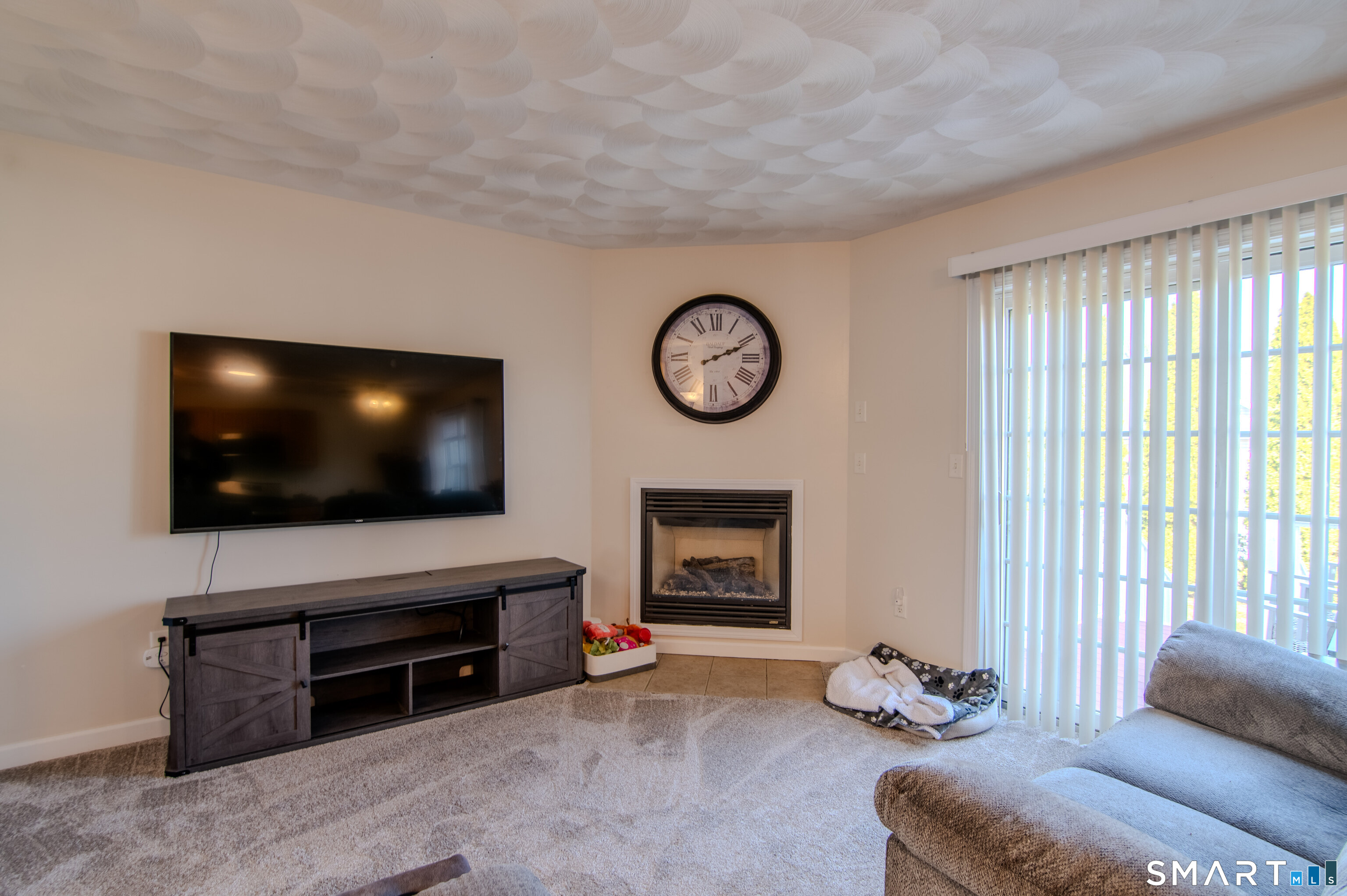 297 Sabin Street, Unit 1 Putnam, CT 06260 - Photo 6 of 20 a living room with furniture and a flat screen tv
