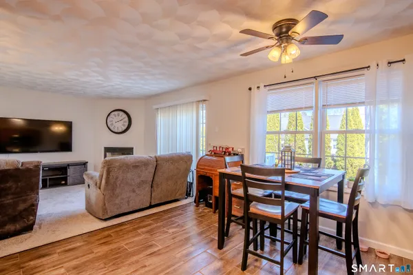 a view of a livingroom with furniture and a flat screen tv