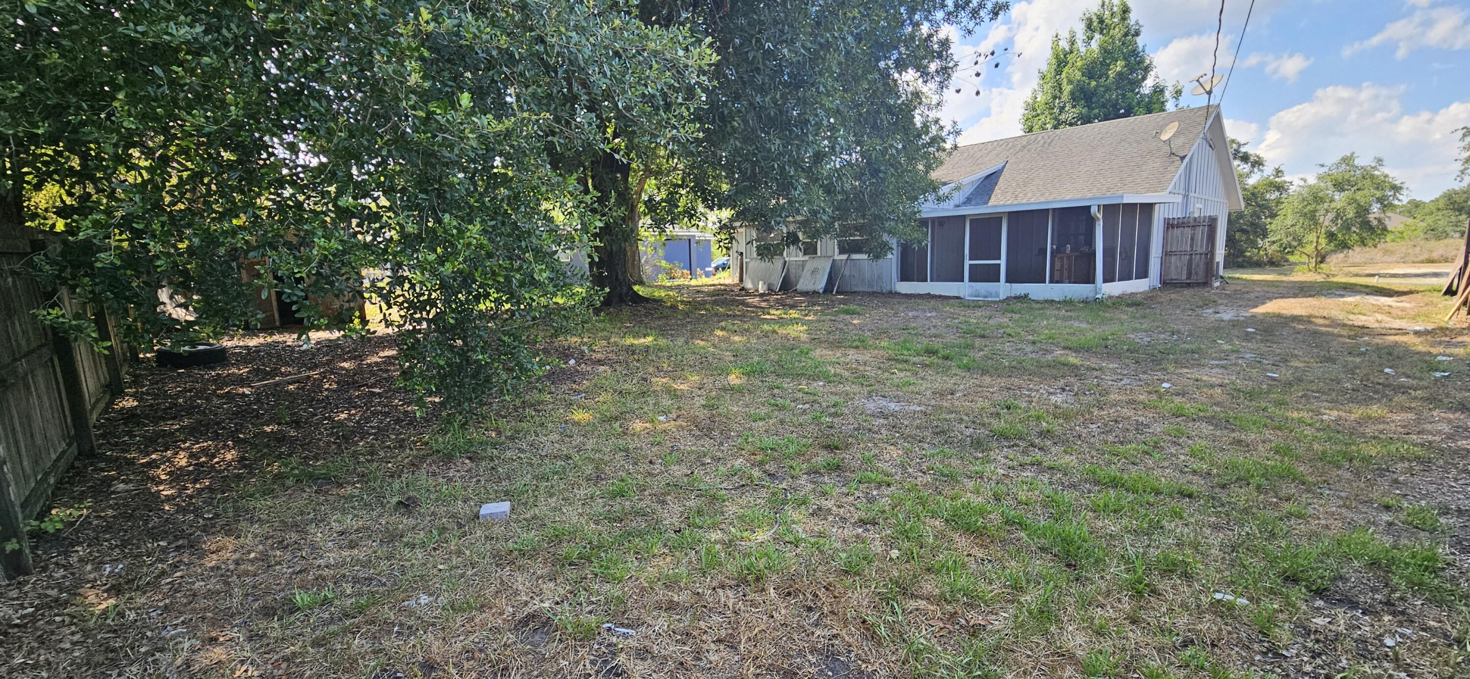 340 San Marino Road Southwest Palm Bay, FL 32908 - Photo 11 of 16 a view of a house with a yard