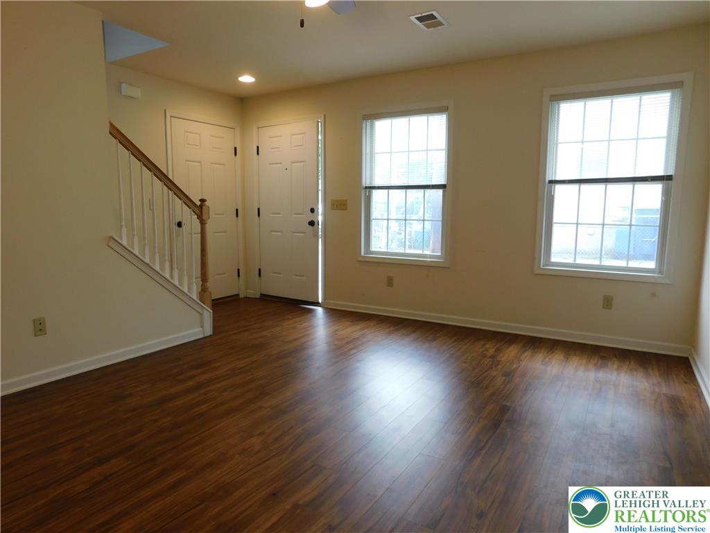 825 Masslich Street Bethlehem, PA 18018 - Photo 7 of 23 an empty room with wooden floor and windows