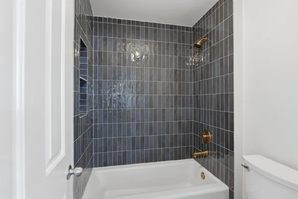 a bathroom with a bath tub