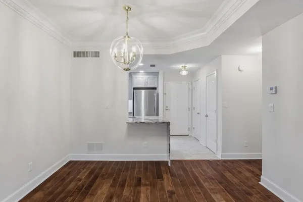 a view of a livingroom with wooden floor