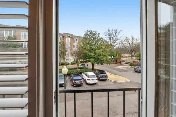a table and chairs in front of a window