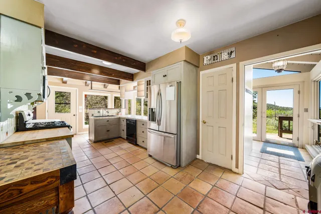 a kitchen with stainless steel appliances granite countertop a stove and a cabinets