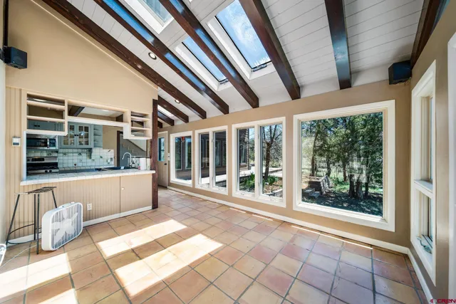 a view of a livingroom with couch and a garage