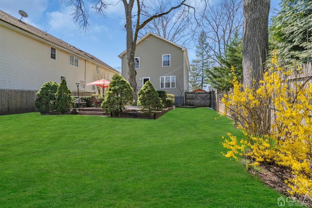 40 Kimberly Road Colonia, NJ 07067 - Photo 11 of 30 a front view of a house with a garden and plants