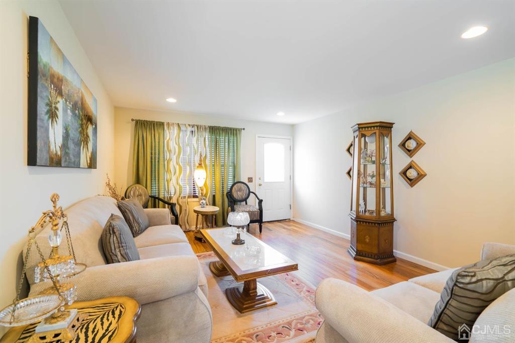 40 Kimberly Road Colonia, NJ 07067 - Photo 13 of 30 a living room with furniture a rug and a table