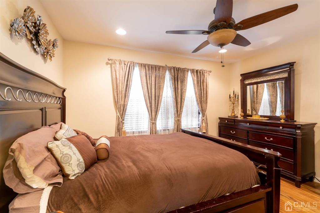 40 Kimberly Road Colonia, NJ 07067 - Photo 16 of 30 a bedroom with a bed and wooden floor