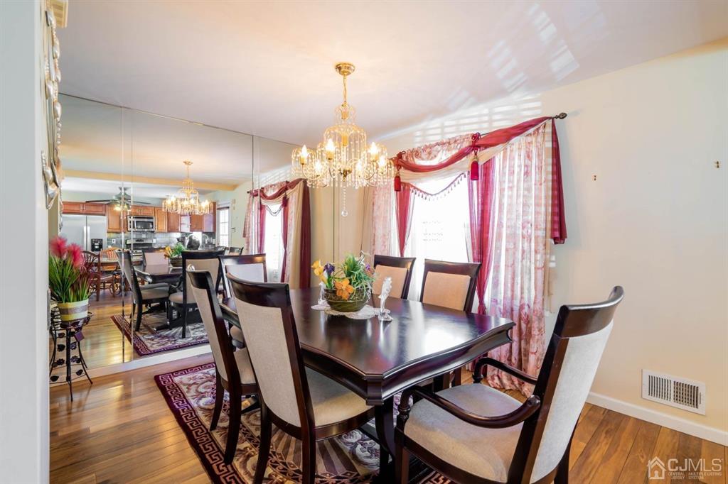 40 Kimberly Road Colonia, NJ 07067 - Photo 17 of 30 a view of a dining room with furniture and wooden floor