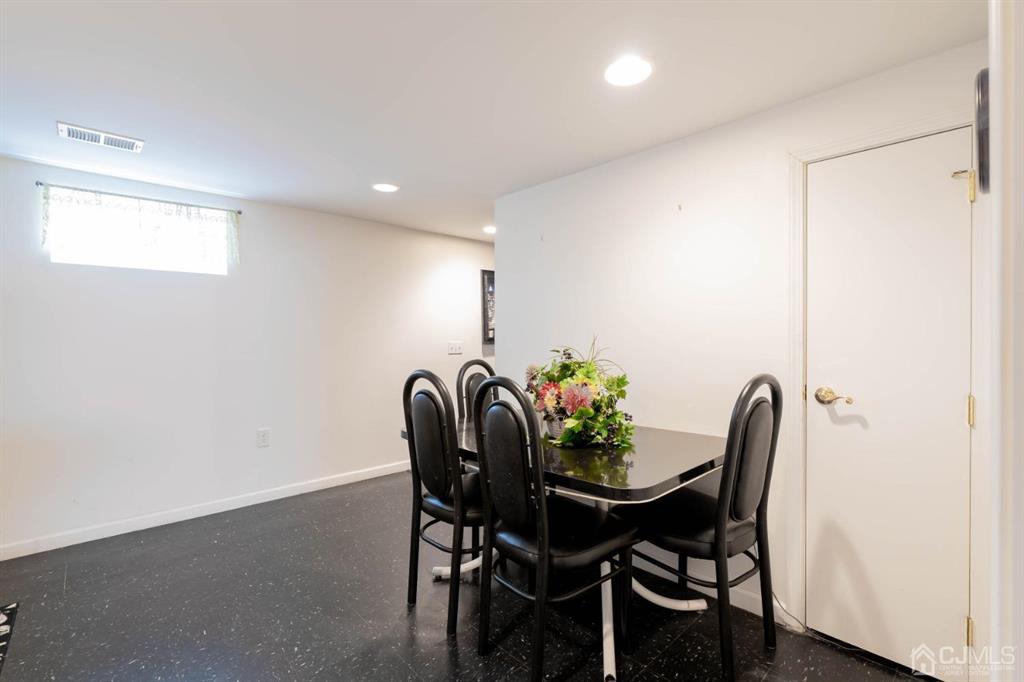 40 Kimberly Road Colonia, NJ 07067 - Photo 20 of 30 a dining room with furniture and a potted plant