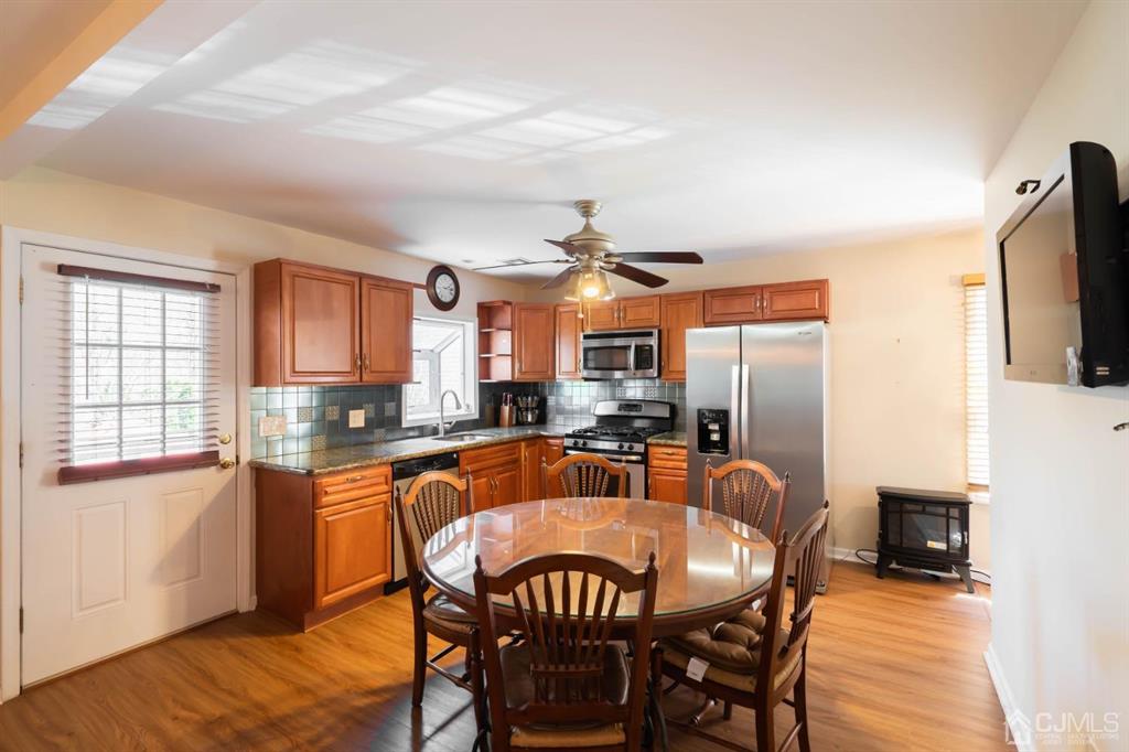 40 Kimberly Road Colonia, NJ 07067 - Photo 25 of 30 a dining room with furniture a window and wooden floor