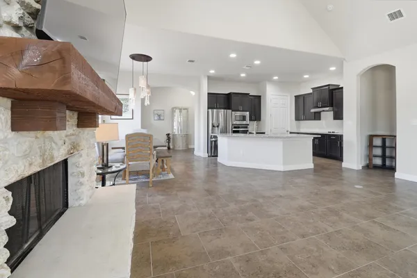 a kitchen with a stove a sink and a refrigerator