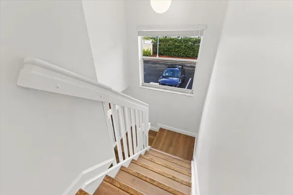 a view of entryway with wooden floor