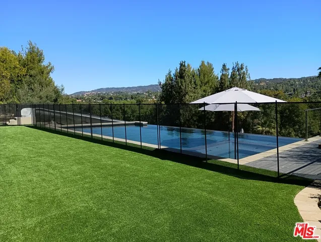 an aerial view of a house with a garden