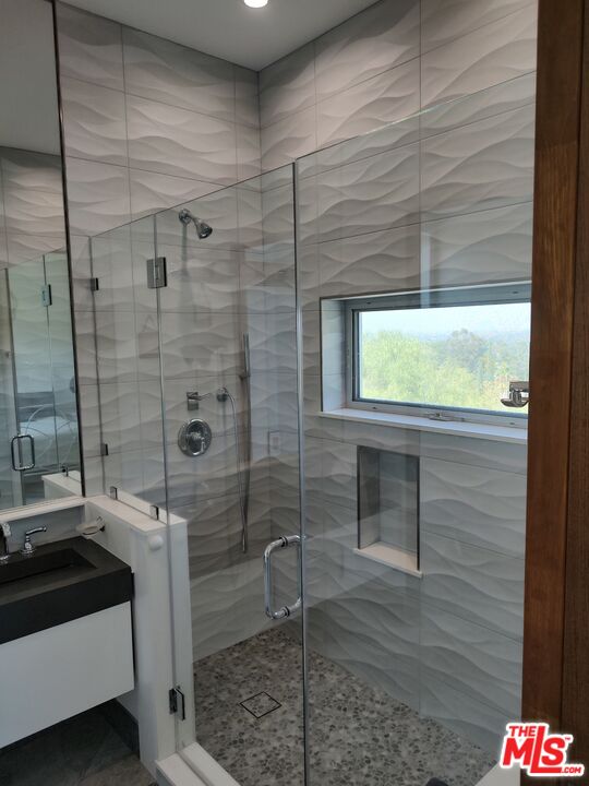 Undisclosed Address Woodland Hills, CA 91367 - Photo 59 of 75 a bathroom with a shower and a sink