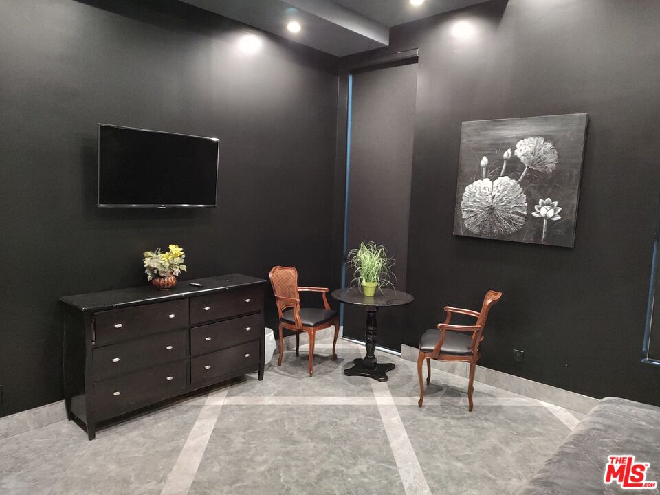 Undisclosed Address Woodland Hills, CA 91367 - Photo 9 of 75 a living room with furniture and a flat screen tv