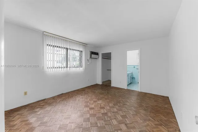 a view of an empty room with windows