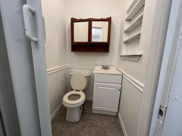 a bathroom with a toilet and a sink