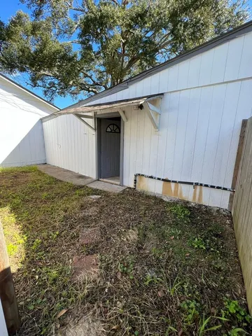 a view of a porch and garden