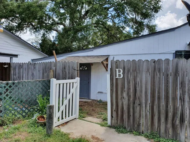 a view of a barn in the back yard