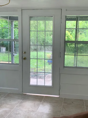 a view of an empty room with a window