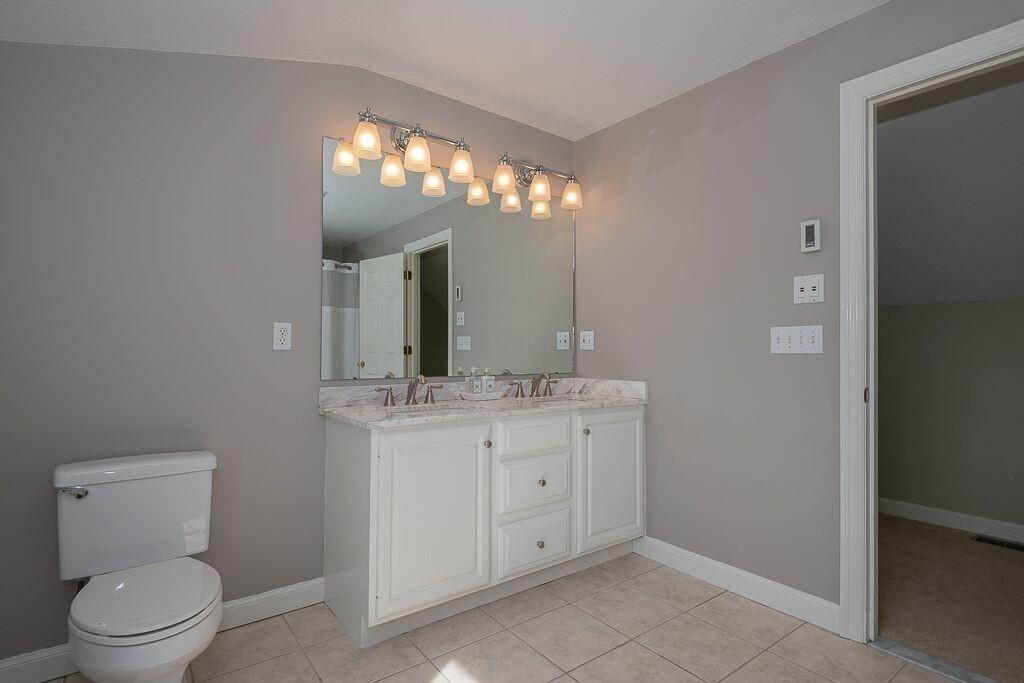 5 Boundary Stone Road Sutton, MA 01590 - Photo 32 of 42 a bathroom with a toilet sink and mirror