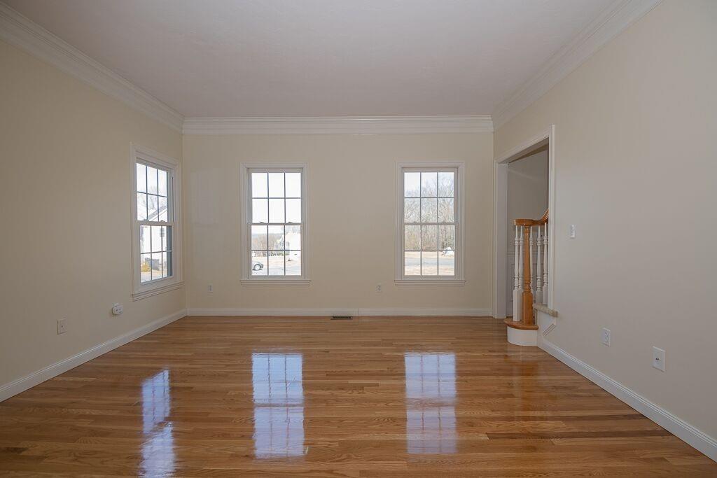 5 Boundary Stone Road Sutton, MA 01590 - Photo 8 of 42 a view of an empty room with wooden floor and a window
