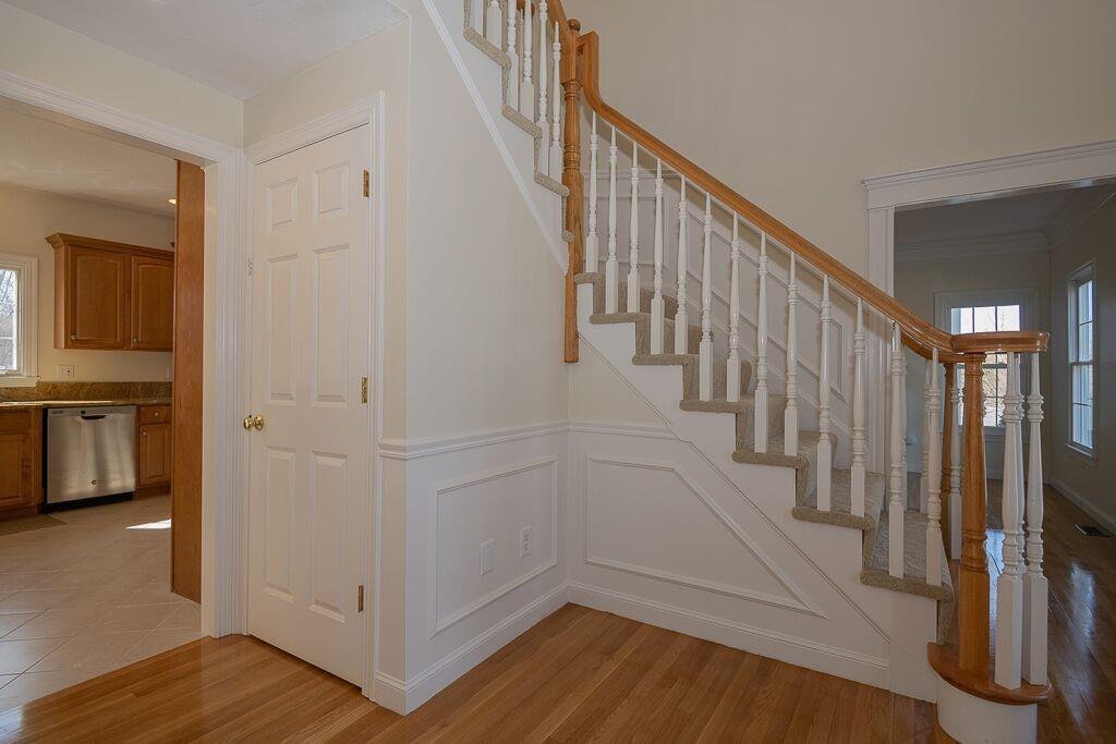 5 Boundary Stone Road Sutton, MA 01590 - Photo 10 of 42 a view of entryway with stairs and wooden floor