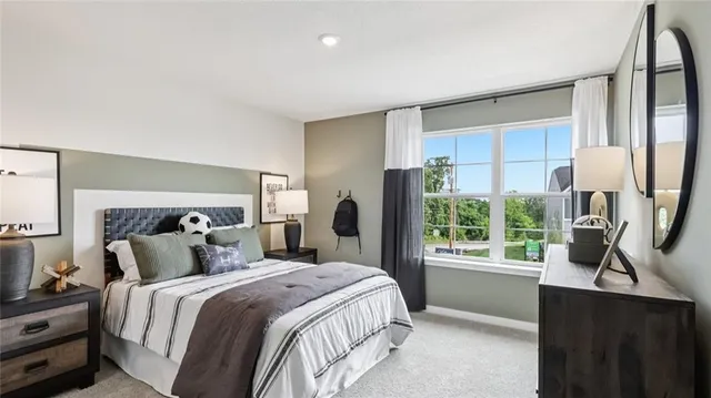 a living room with furniture and a lamp