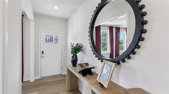 a work place with wooden furniture and a mirror