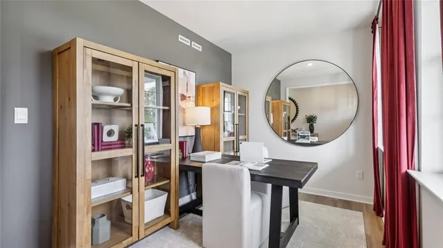 a dining room with furniture and window
