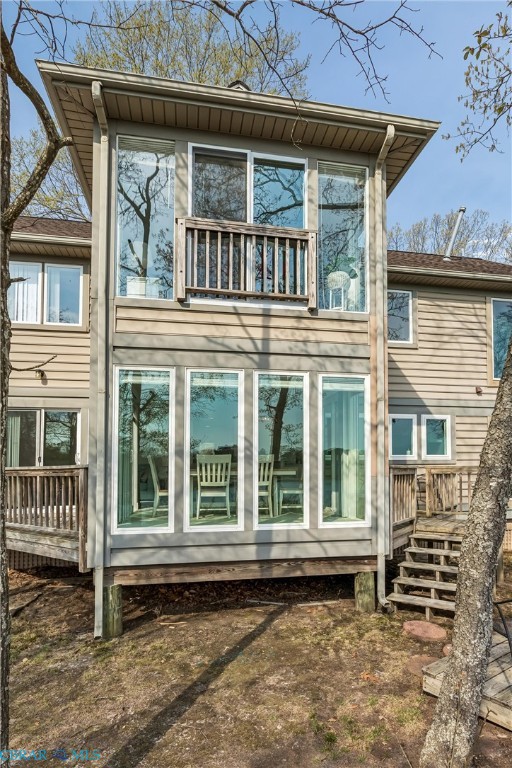 172 Sturgeon Creek Road Deltaville, VA 23043 - Photo 36 of 50 Rear view of house with a wooden deck and a balcony