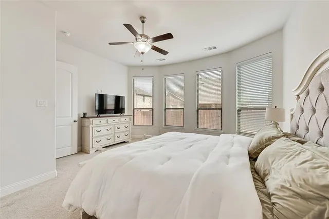 a bedroom with a bed and a cabinets