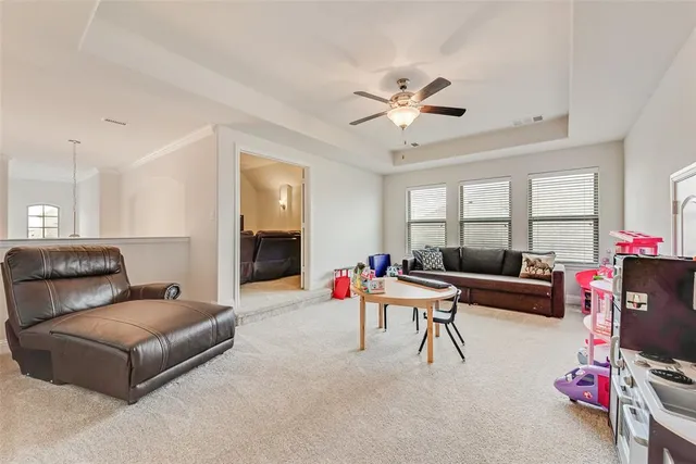 a bathroom with a sink a toilet and shower curtain