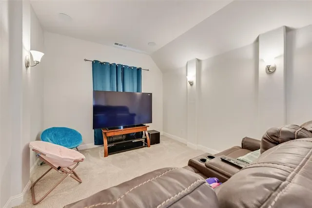 a living room with furniture and white walls