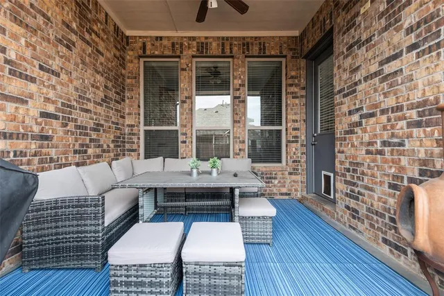 a view of a livingroom with furniture and windows