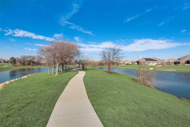 a view of a golf course with a lake