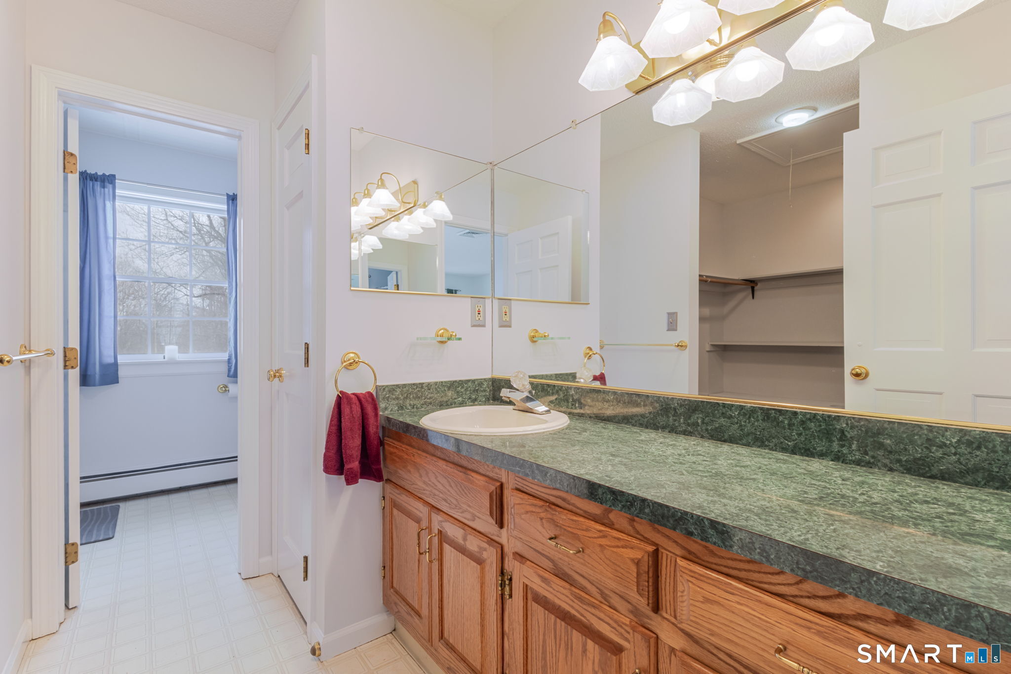 279 Old Mountain Road Southington, CT 06444 - Photo 11 of 37 a bathroom with a sink and a mirror