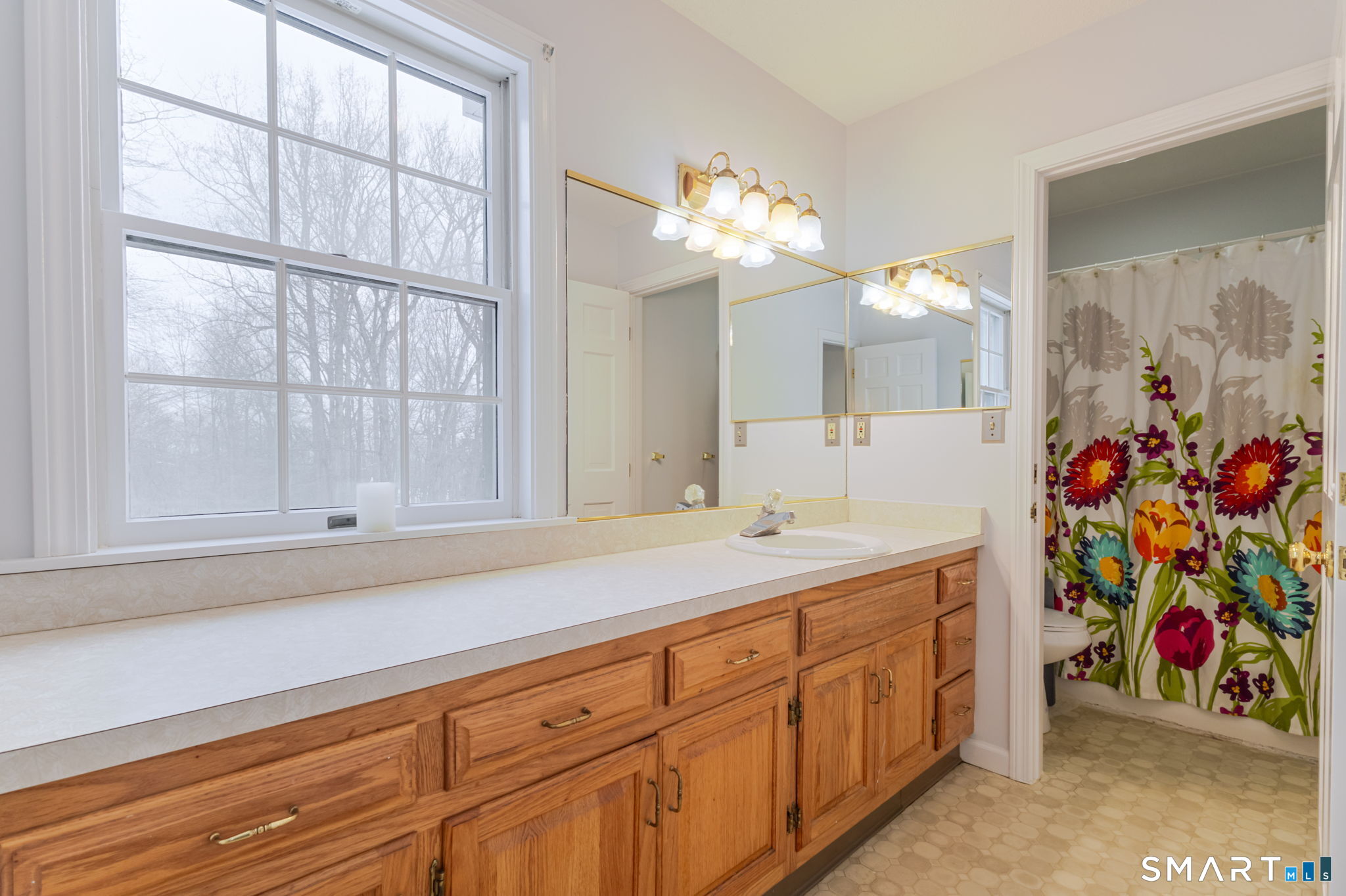 279 Old Mountain Road Southington, CT 06444 - Photo 13 of 37 a bathroom with a sink a vanity and a large mirror