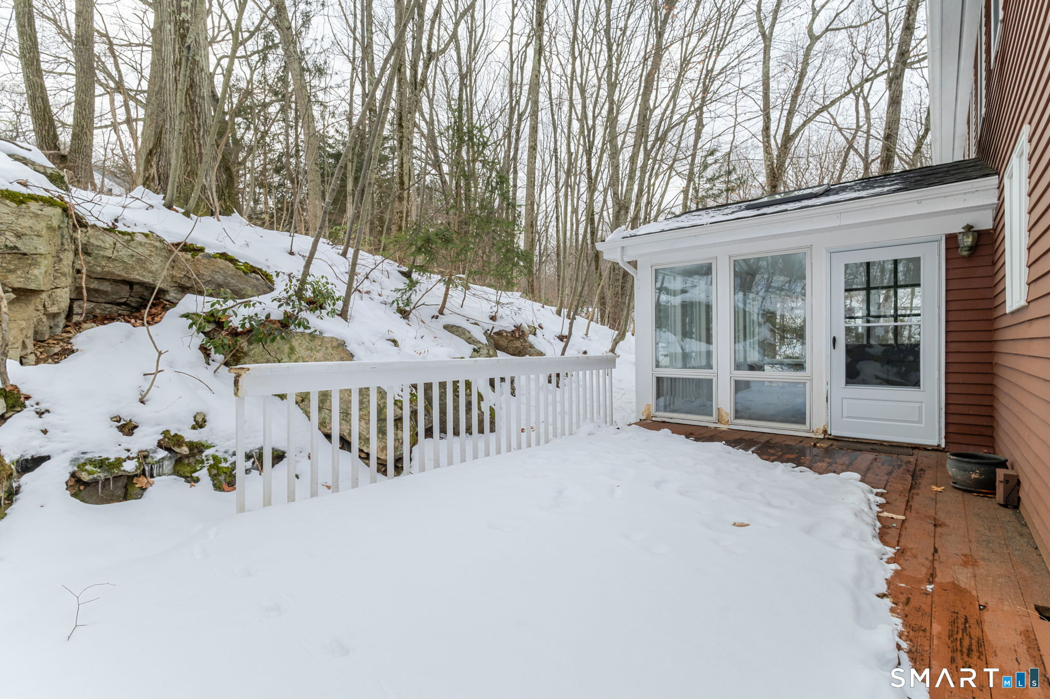 279 Old Mountain Road Southington, CT 06444 - Photo 15 of 37 a view of a patio with a table and chairs